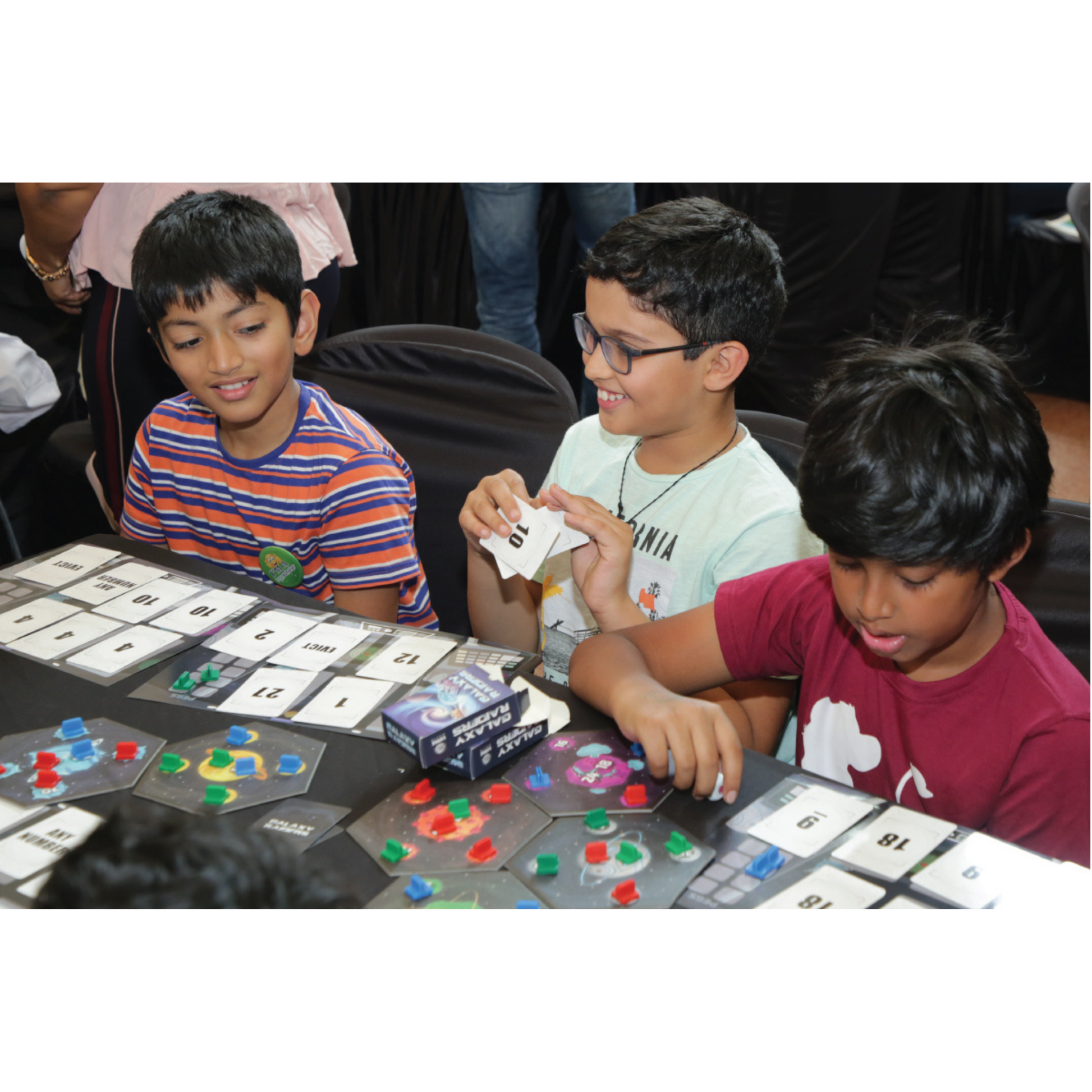 Kids playing Galaxy Raiders, enhancing STEM problem-solving skills.